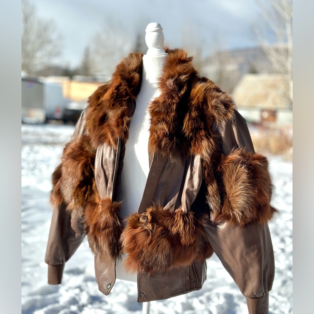 Used like New cow leather jacket, adorned with fox fur